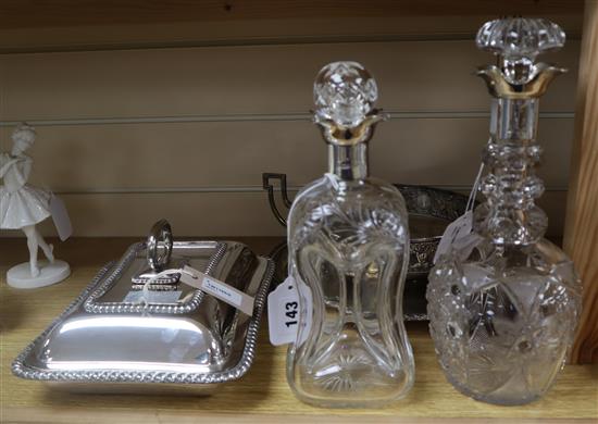 A silver-mounted dimple decanter, a similar cut glass decanter, a plated entree dish and two other plated items